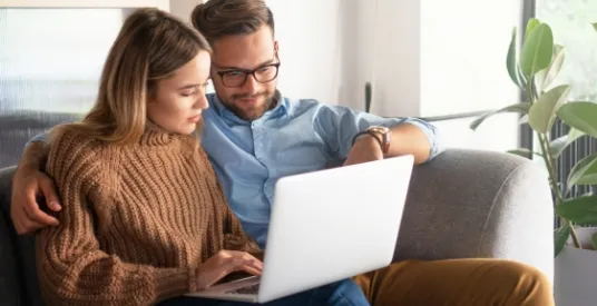 couple using laptop