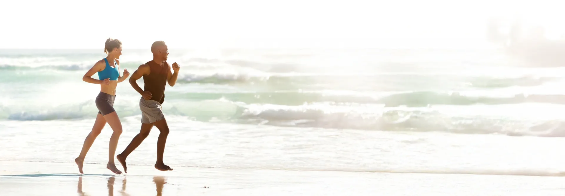 couple running on the beach