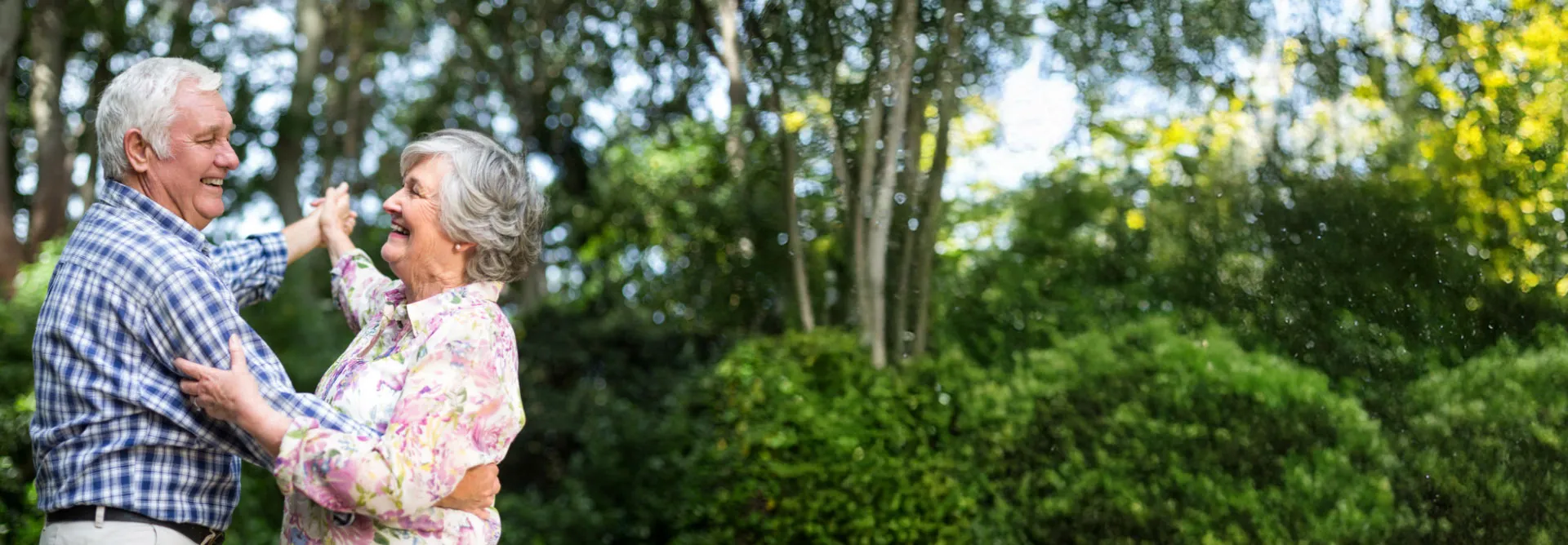 older couple dancing outside