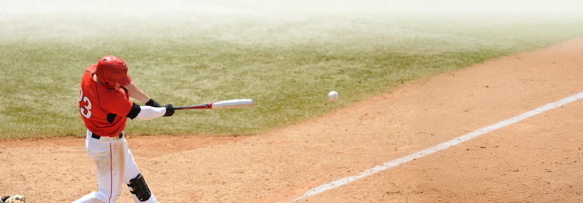 baseball player in mid-swing