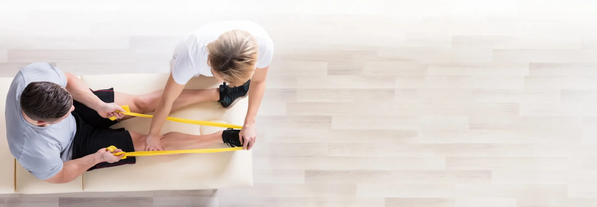 therapist helping patient