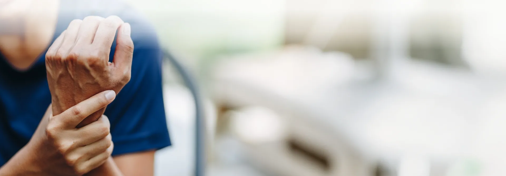 patient holding painful wrist