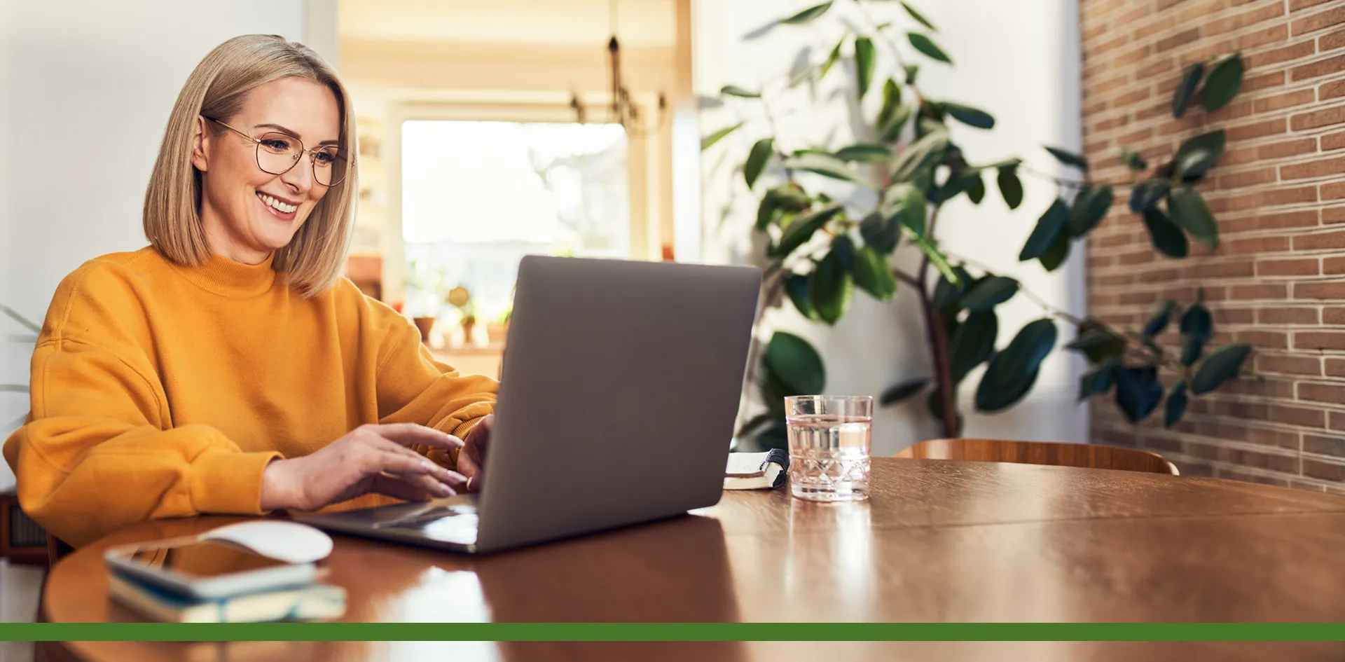 smiling woman using laptop